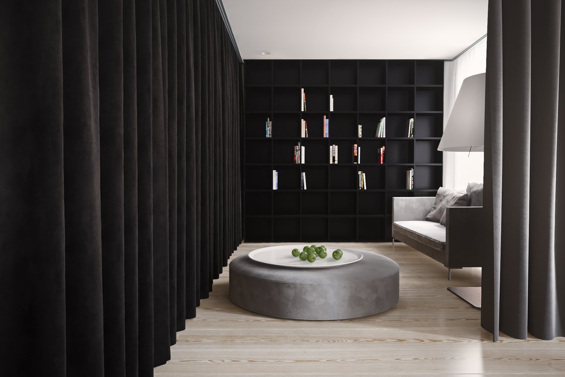 : 3D Visualization by gmsvision of a modern Berlin apartment with a black bookcase, a grey sofa, and a large round table creating an elegant reading corner.