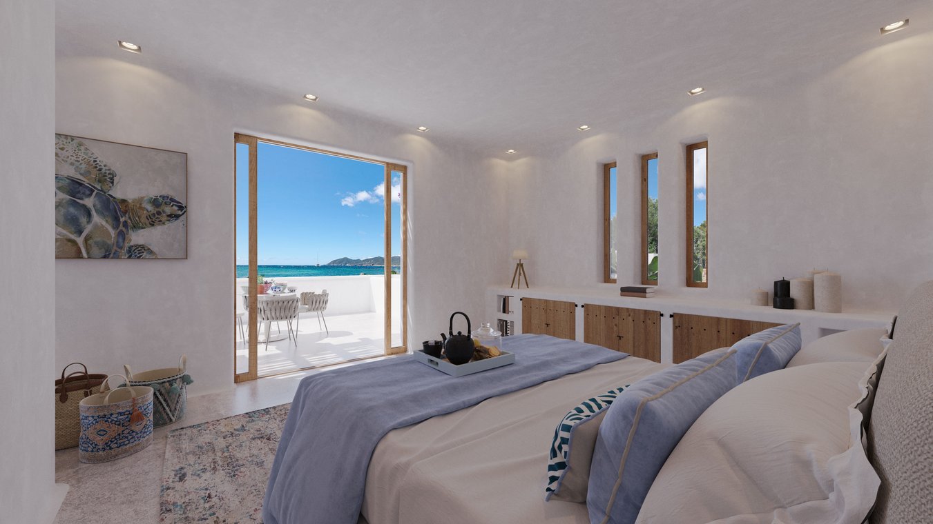 Bright bedroom with sea view, double bed, and access to the terrace in Ibiza