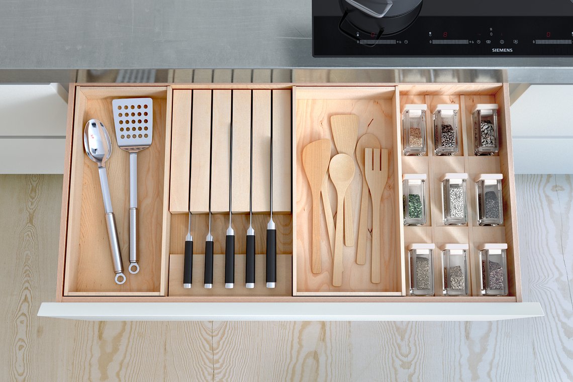 3D Visualization of a Bulthaup kitchen drawer with neatly organized cutlery, utensils, and spice jars.