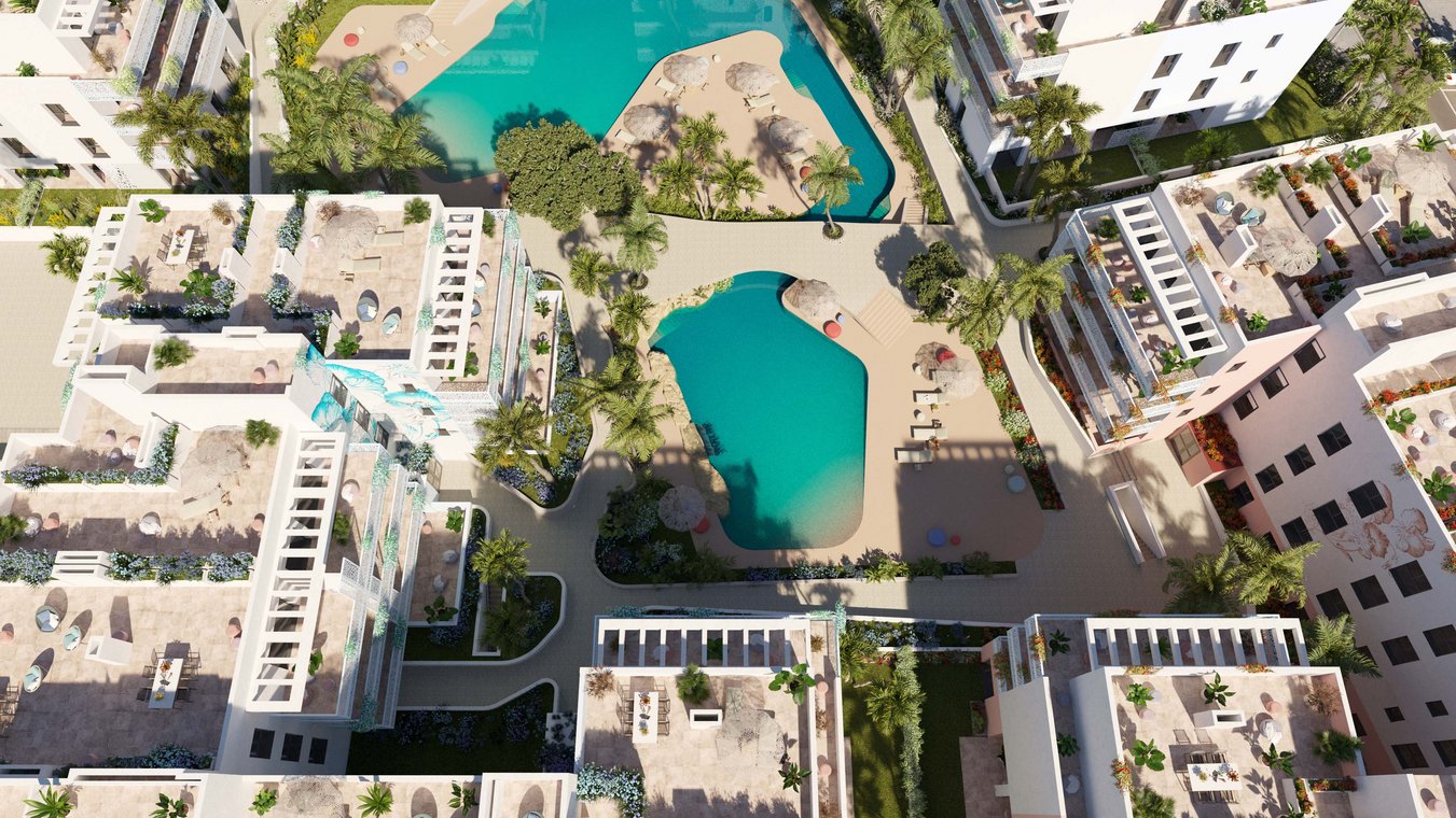 3D visualization of the CREO Ibiza residential complex from a bird’s-eye view, featuring modern-designed buildings, two turquoise pools surrounded by parasols, sun loungers, palm trees, and colorful greenery